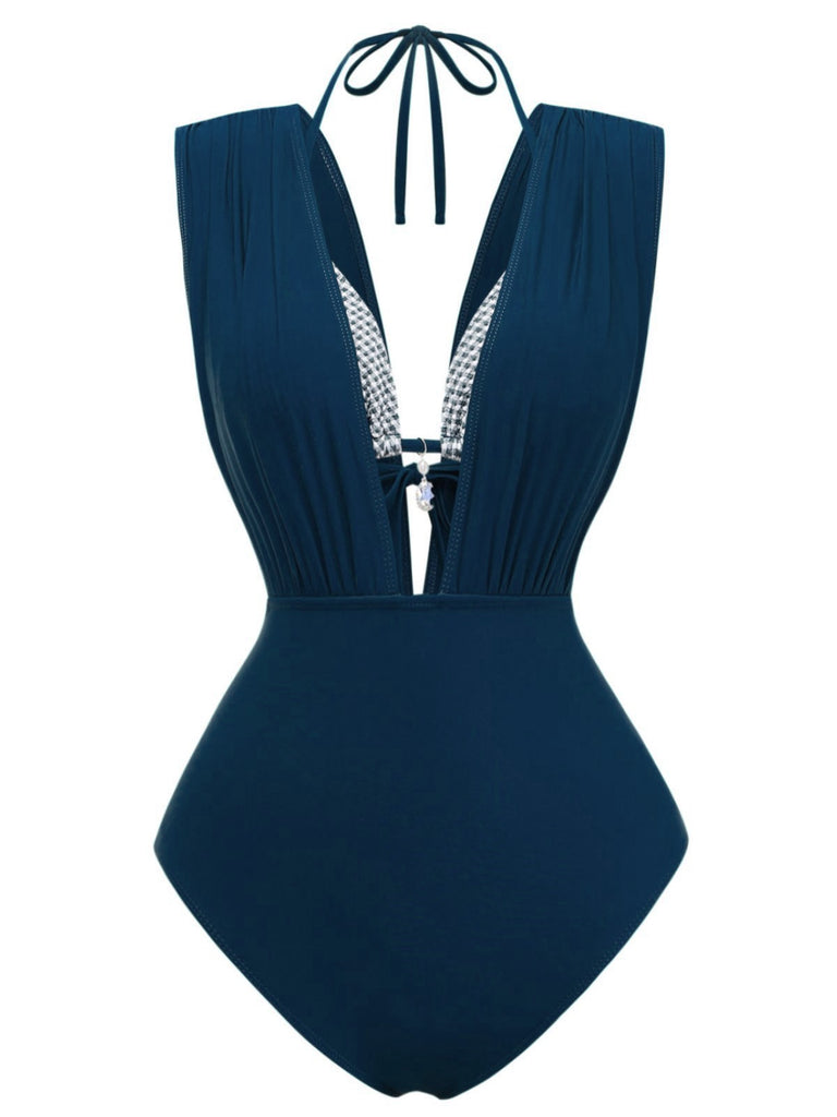 Navy blue swimsuit with a halter neck design on a white background