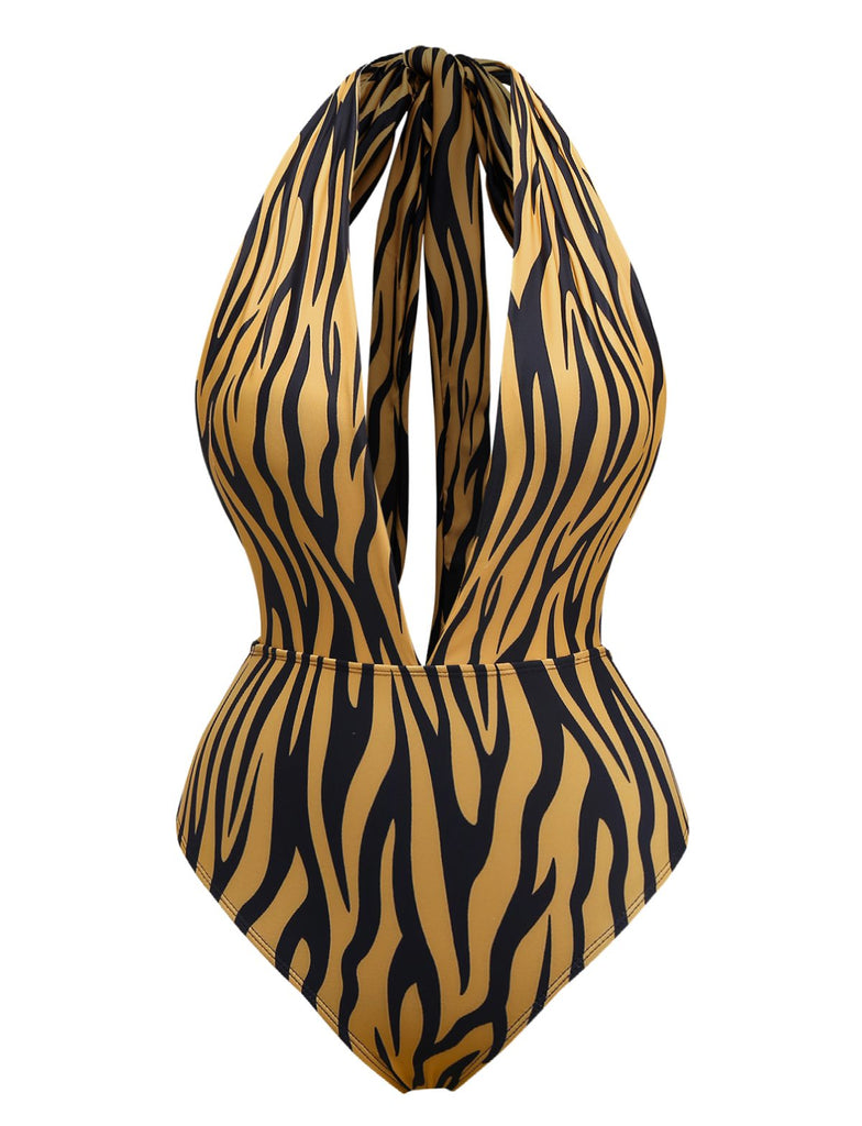 She's wearing Brown 1960s Deep-V Zebra Stripe One-Piece Swimsuit and the whole beach remembers the 1960s