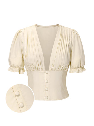 She pairs this Cream 1940s Cotton Deep V-Neck Ruched Top with confidence and 1940s charm