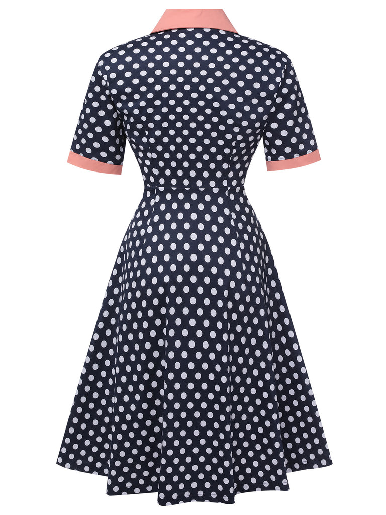 This Dark Blue 1950s Polka Dot Lapel Dress wraps her in 1950s elegance, one twirl at a time