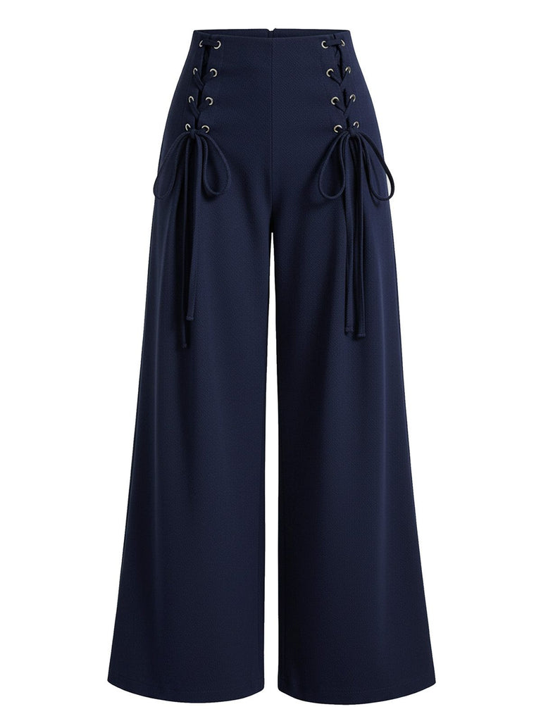 Navy blue wide-leg pants with lace-up details on a white background