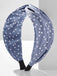 She finds her vintage story in this Fabric Wide Brim Polka Dot Cross Headband