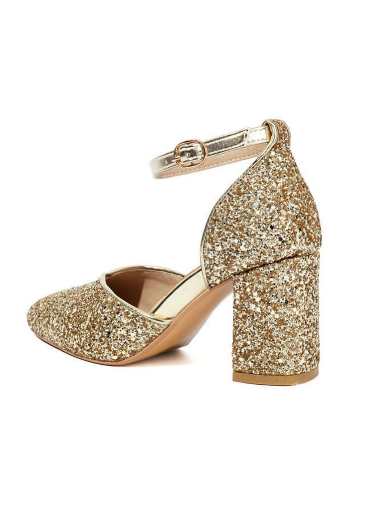 Gold glitter high-heeled shoe on a white background