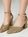 Gold glitter high heels on a neutral background