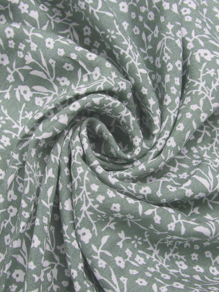 Green 1940s Ditsy Floral Flounce Sleeve Dress — the kind of 1940s dress that makes strangers smile