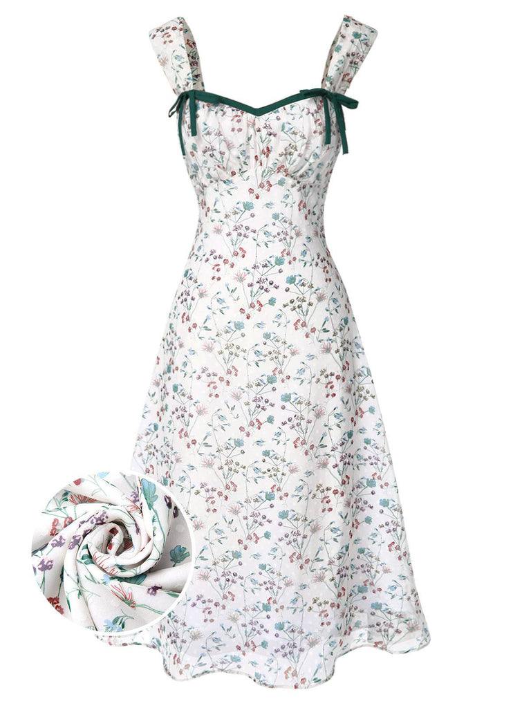 Floral dress with green straps on a white background