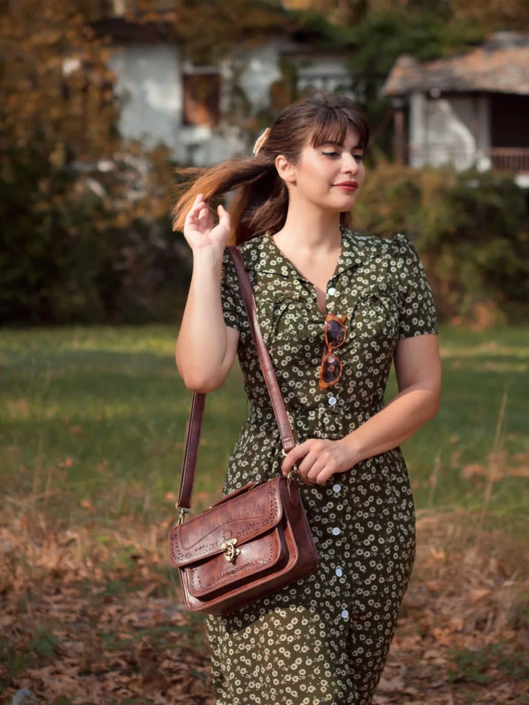She slips into this Green 1940s Lapel Buttons Ditsy Floral Dress and suddenly it's a 1940s daydream