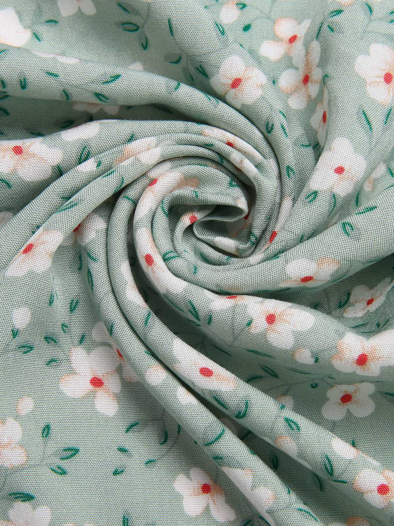 Green 1940s V-Neck Ditsy Floral Irregular Hem Dress — the kind of 1940s dress that makes strangers smile