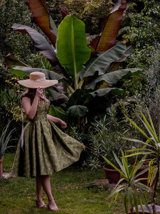 She slips into this Green 1950s Off-Shoulder Vintage Dress and suddenly it's a 1950s daydream