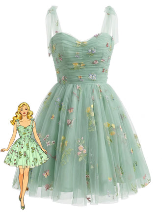 Green floral dress with a paper doll illustration on a white background