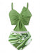 She's wearing Green 1960s Knotted Watercolor Straps Swimsuit and the whole beach remembers the 1960s