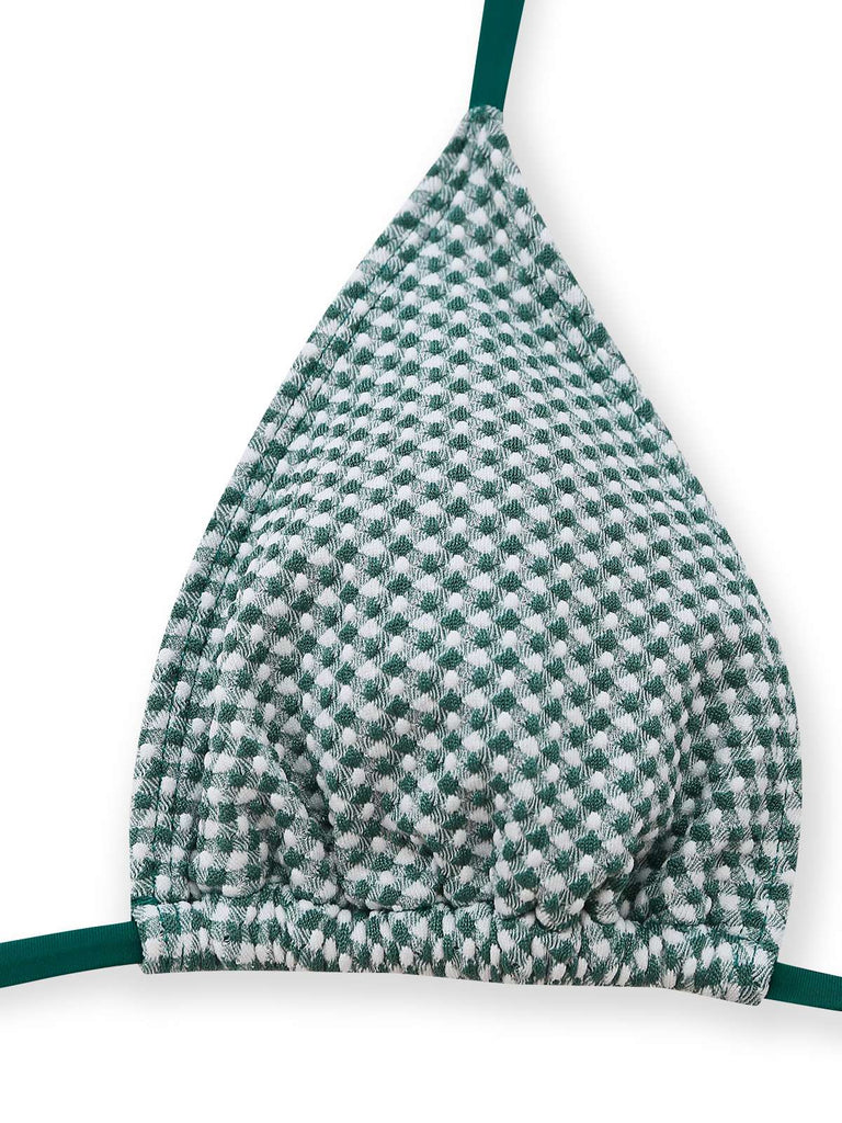 Green and white checkered fabric on a white background