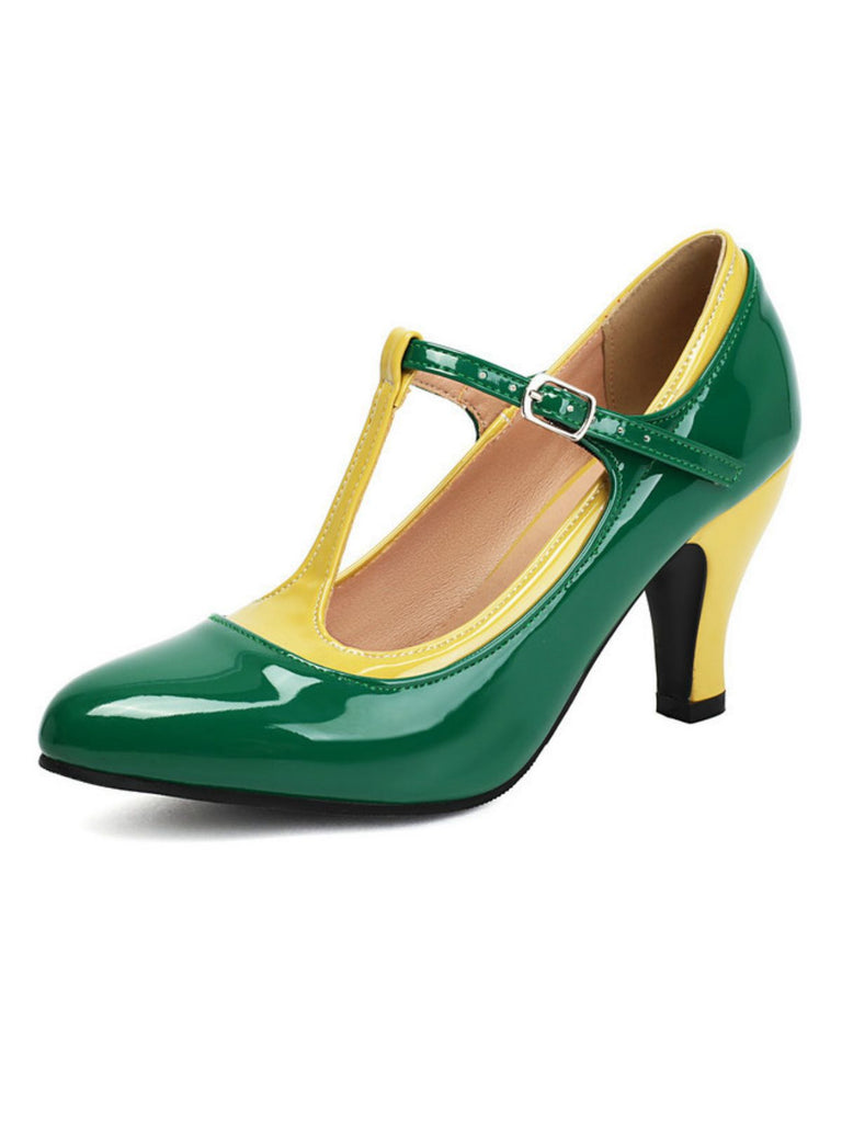 Green and yellow high-heeled shoe on a white background