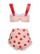 She's wearing Lace Strawberry Cami Tankini Set and the whole beach remembers the vintage