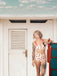 She's wearing Lace Strawberry Cami Tankini Set and the whole beach remembers the vintage