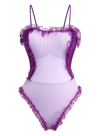 She's wearing Lavender 1950s Stripe Mesh Ruffle One-Piece Swimsuit and the whole beach remembers the 1950s