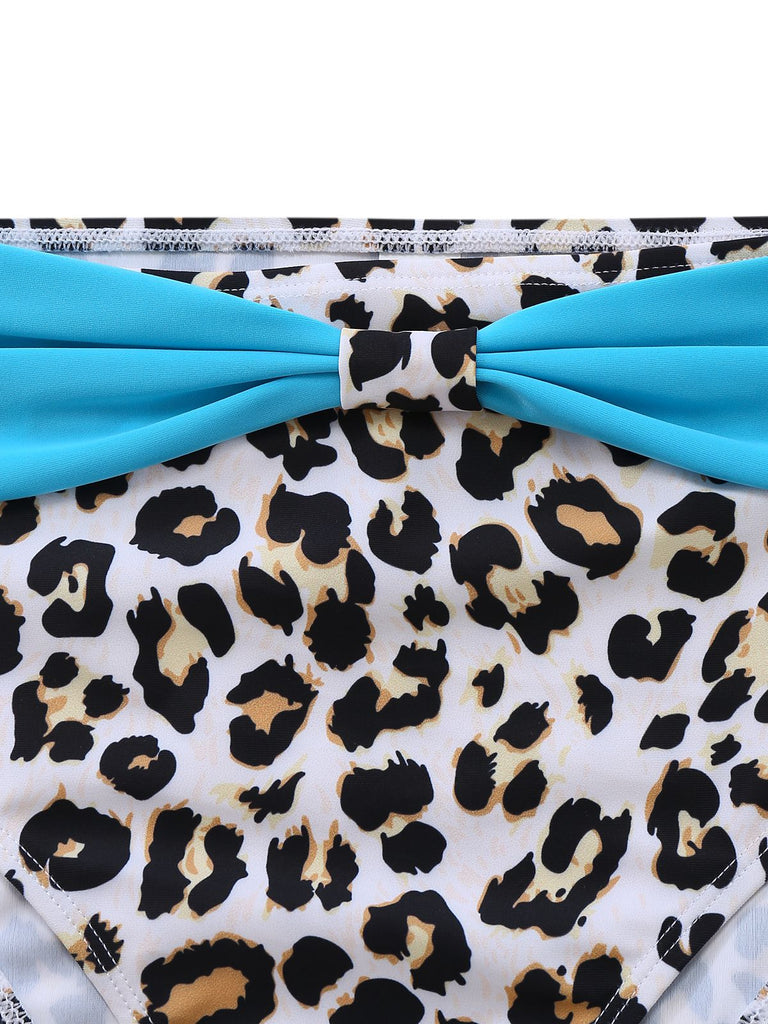 Leopard print swimsuit with blue straps on a white background
