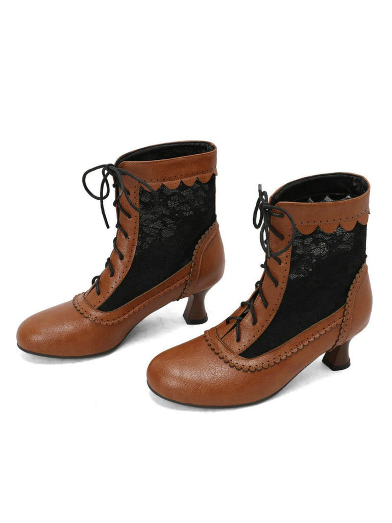 Pair of brown lace-up boots with black accents on a white background