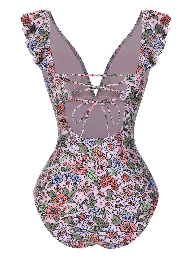 She's wearing 1950s Floral Ring Belted Ruffles Swimsuit and the whole beach remembers the 1950s