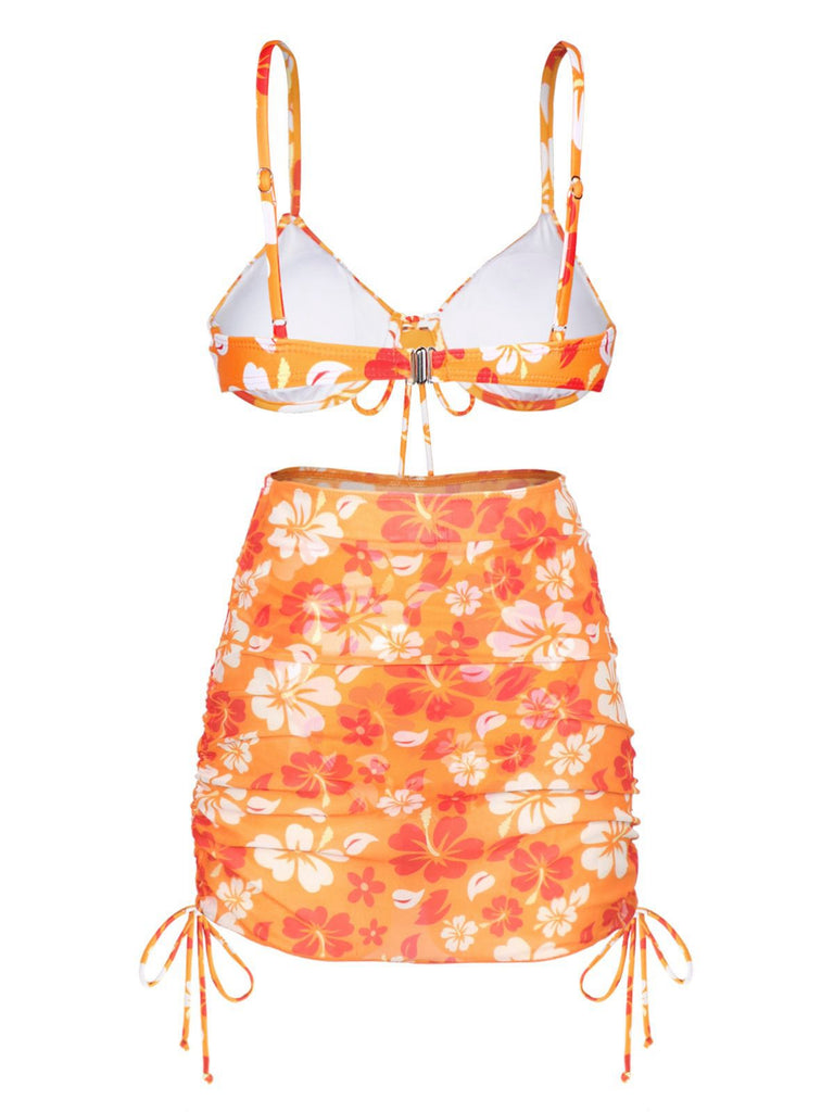 This Orange 1950s Silhouette Floral Straps Skirt Bikini carries 1950s vacation dreams in every stitch