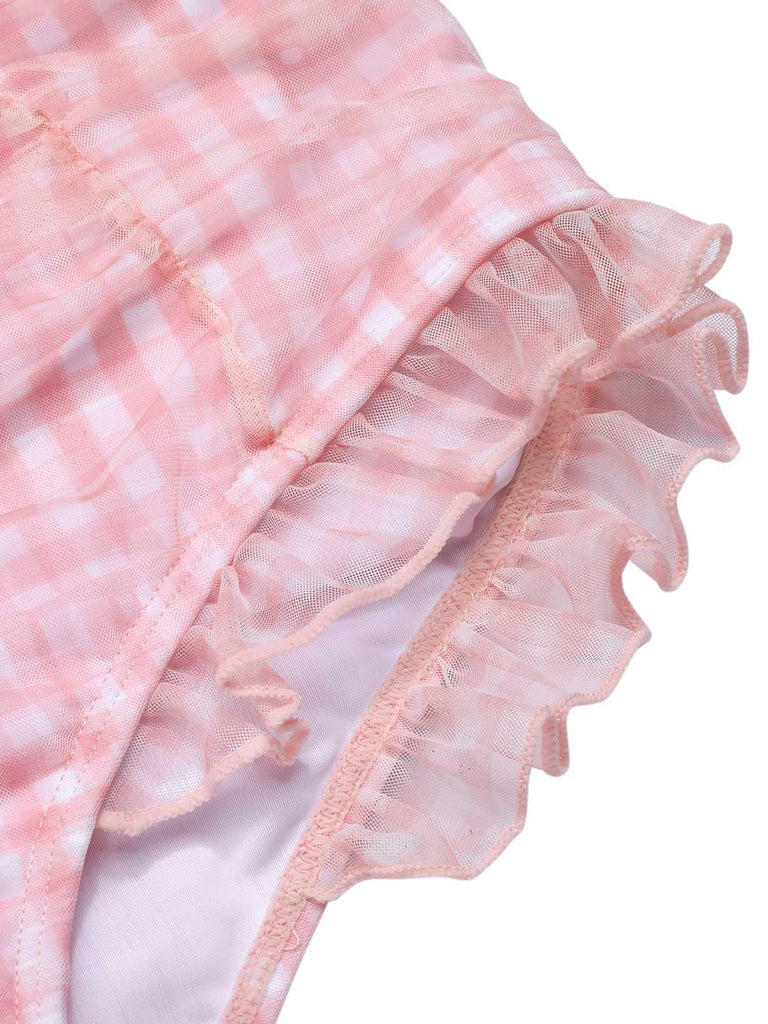 She's wearing Pink 1940s Spaghetti Strap Mesh Plaids Swimsuit and the whole beach remembers the 1940s