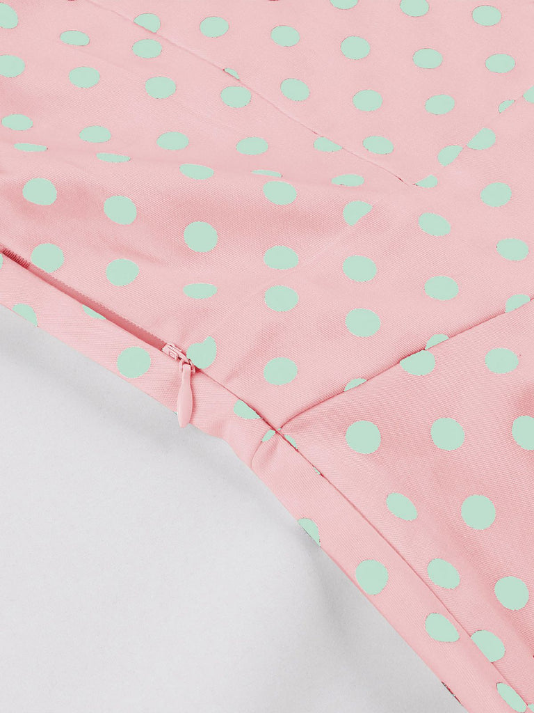 This Pink 1950s Blue Polka Dot Lapel Dress wraps her in 1950s elegance, one twirl at a time