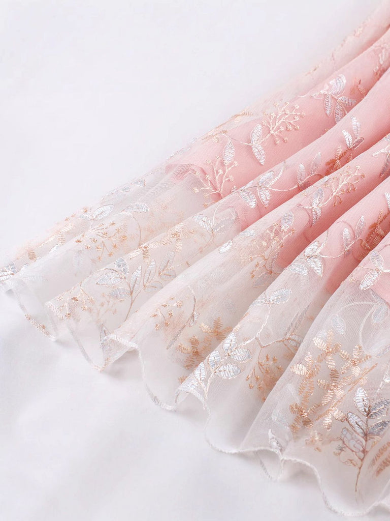This Pink 1950s Lace-Up Straps Floral Mesh Dress wraps her in 1950s elegance, one twirl at a time