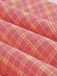 She slips into this Pink 1950s Plaid Buttoned Lapel Belted Dress and suddenly it's a 1950s daydream