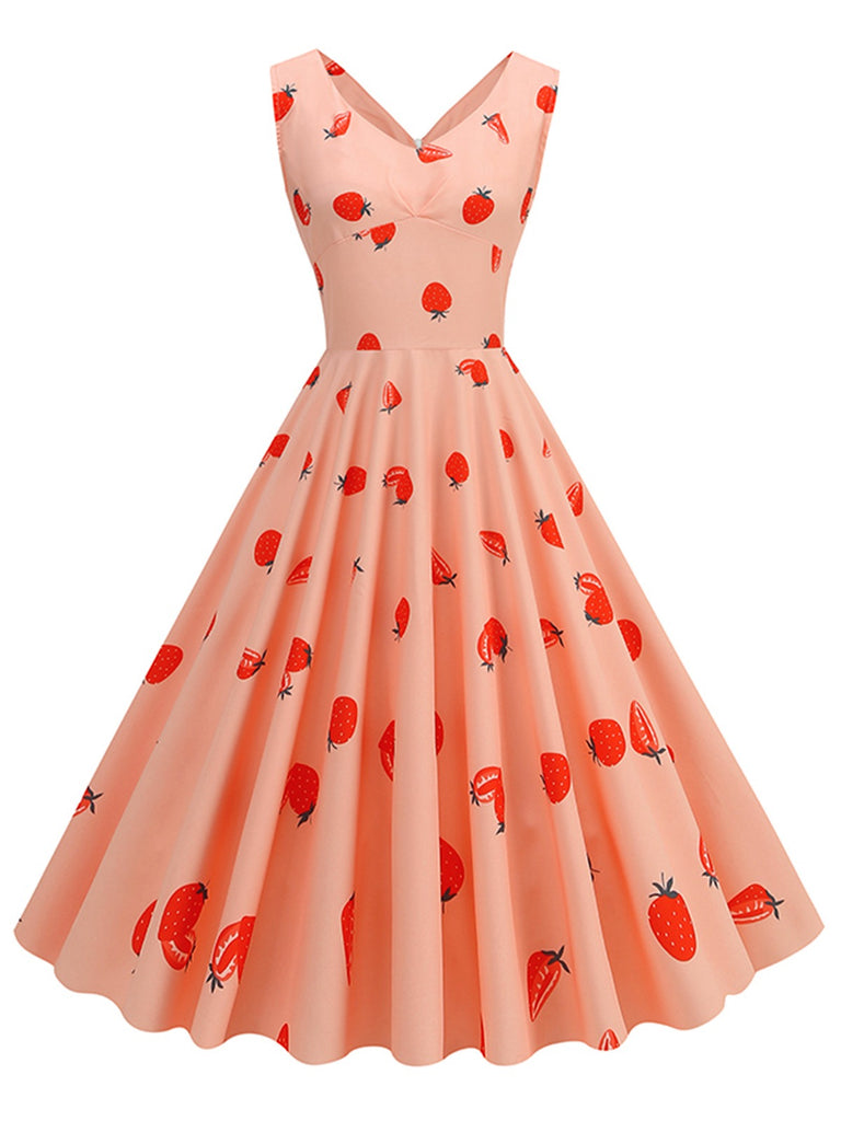She slips into this Pink 1950s Strawberry Sleeveless Swing Dress and suddenly it's a 1950s daydream