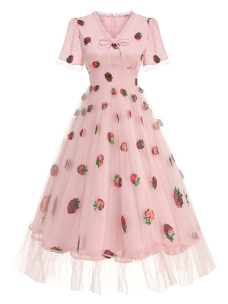 She slips into this Pink 1950s V-Neck Strawberry Mesh Swing Dress and suddenly it's a 1950s daydream