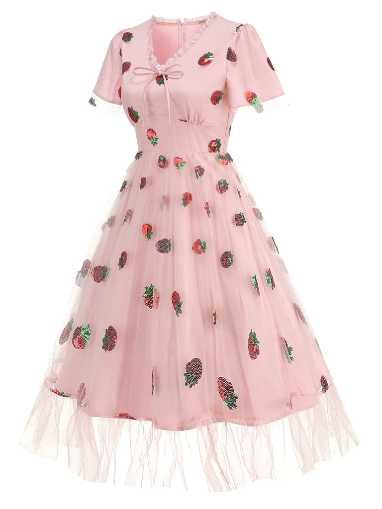 This Pink 1950s V-Neck Strawberry Mesh Swing Dress wraps her in 1950s elegance, one twirl at a time