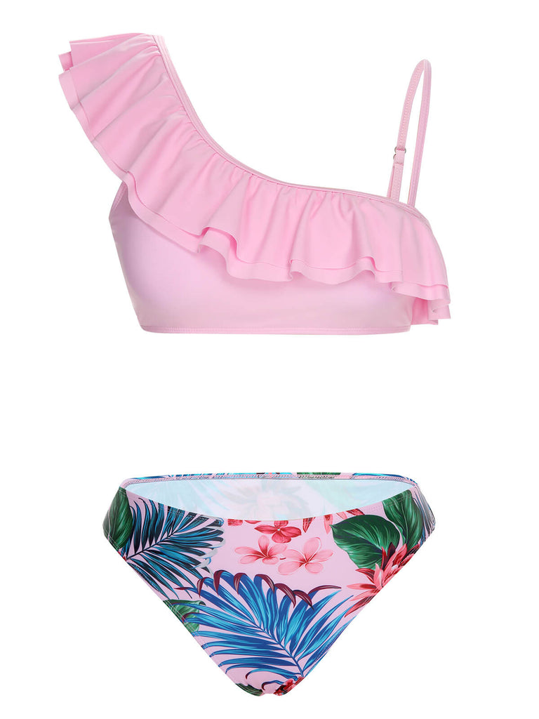 She's wearing Pink 1960s Tropical Plants Ruffles Swimsuit and the whole beach remembers the 1960s