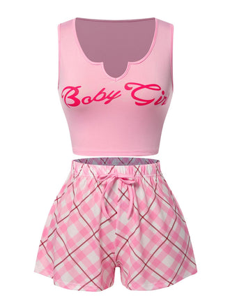 She pairs this Pink 1970s Baby Girl Tank Top & Plaid Shorts Pajamas with confidence and 1970s charm