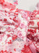 This Pink 1980s Spaghetti Strap Ditsy Floral Tiered Dress wraps her in 1980s elegance, one twirl at a time