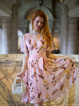 She slips into this Pink Flowers And Birds Bowknot V-Neck Dress and suddenly it's a vintage daydream