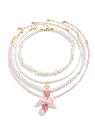 She adds this Pink & White Pearl Bow Butterfly Necklace Set and suddenly it's vintage perfection
