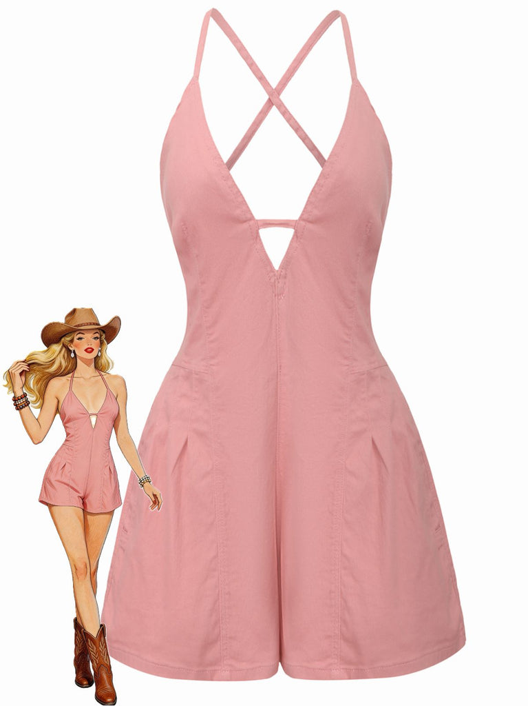 Pink romper with criss-cross straps on a white background