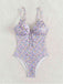 This Purple 1950s Ditsy Floral Lace-Up One-Piece Swimsuit carries 1950s vacation dreams in every stitch