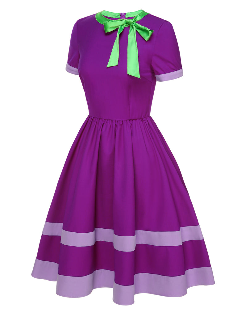 This Purple 1950s Solid Spliced Tie Neck Dress wraps her in 1950s elegance, one twirl at a time