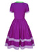 Purple 1950s Solid Spliced Tie Neck Dress — the kind of 1950s dress that makes strangers smile