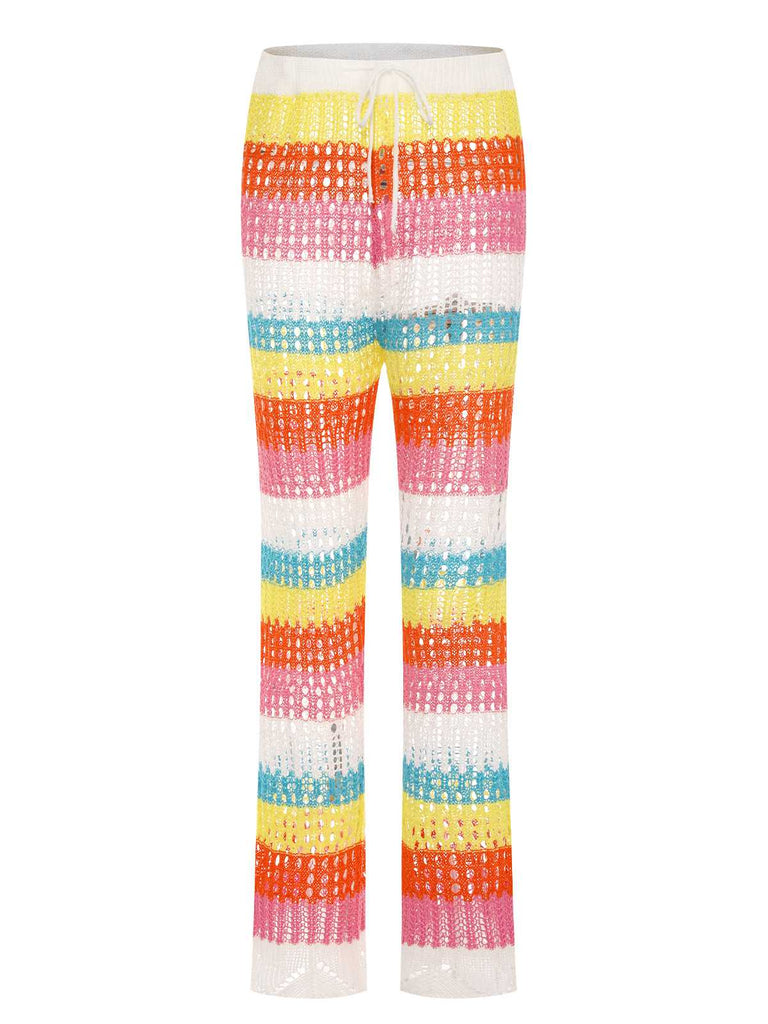 She's wearing Rainbow 1970s Hollow Knitted Beach Pants and the whole beach remembers the 1970s