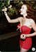 She's wearing Red 1940s Bow Straps One-Piece Swimsuit and the whole beach remembers the 1940s