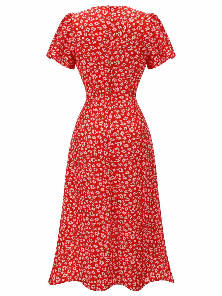 This Red 1940s Floral V-Neck Added Button Dress wraps her in 1940s elegance, one twirl at a time