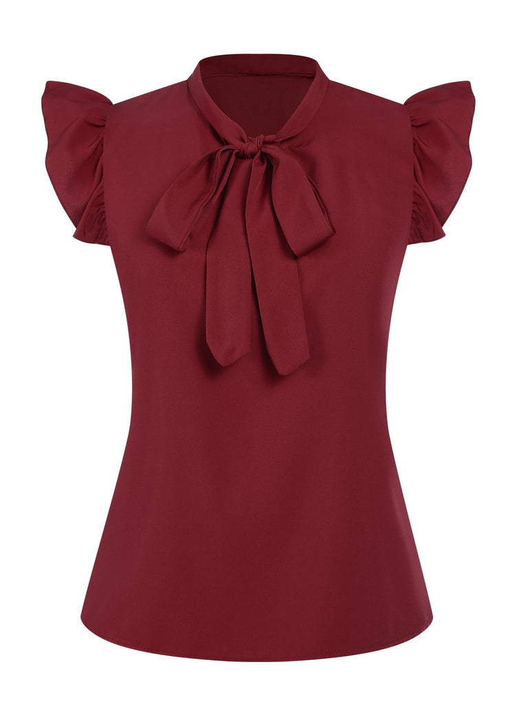 She pairs this Red 1940s Solid Tie-Neck Ruffle Sleeve Blouse with confidence and 1940s charm