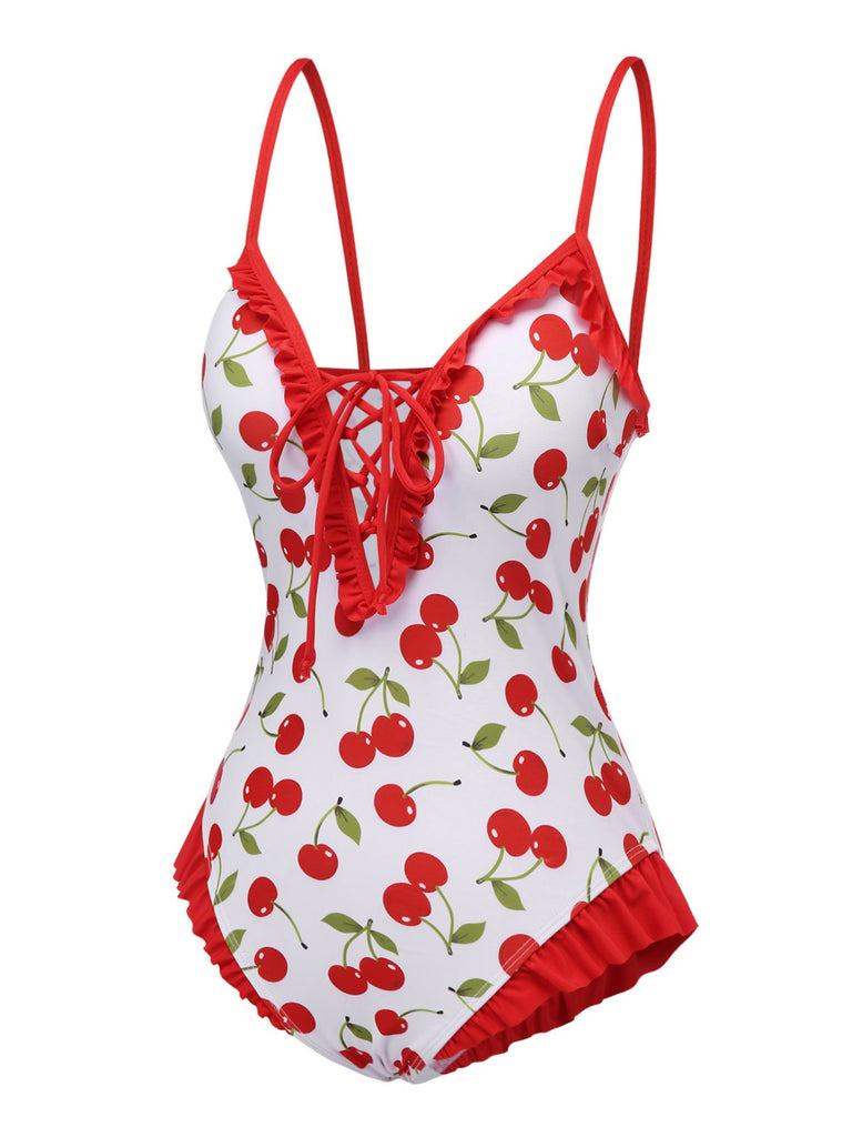 This Red 1950s Cherry Lace-Up Ruffled Swimsuit carries 1950s vacation dreams in every stitch