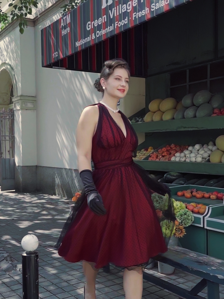 This Red 1950s Dots Mesh Swing Dress wraps her in 1950s elegance, one twirl at a time