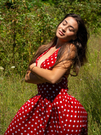 She slips into this Red 1950s Polka Dot Halter Dress and suddenly it's a 1950s daydream