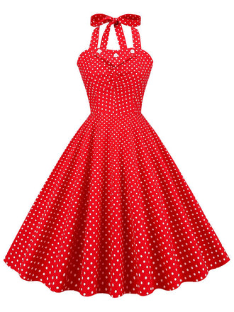 She slips into this Red 1950s Polka Dot Halter Swing Dress and suddenly it's a 1950s daydream