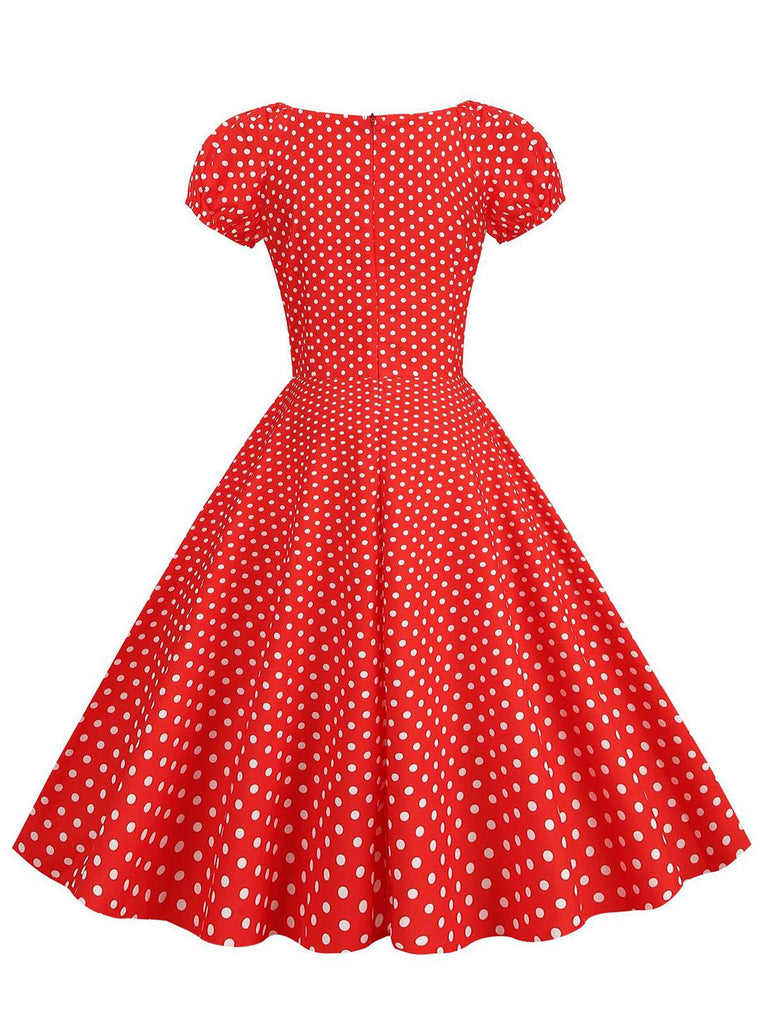 This Red 1950s Polka Dot Sweetheart Neck Bow Dress wraps her in 1950s elegance, one twirl at a time