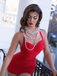 She's wearing Red 1950s Solid Gathered Halter Swimsuit and the whole beach remembers the 1950s